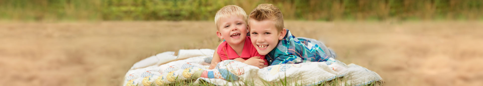 Two boys on blanket