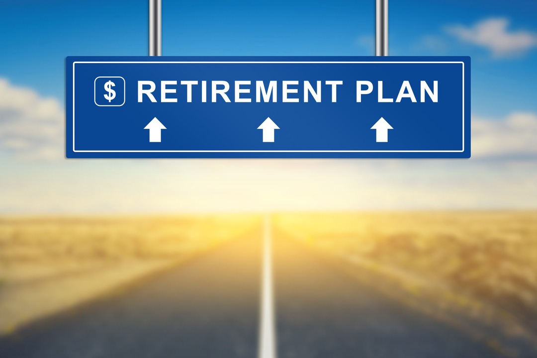 retirement plan words on blue road sign with blurred background