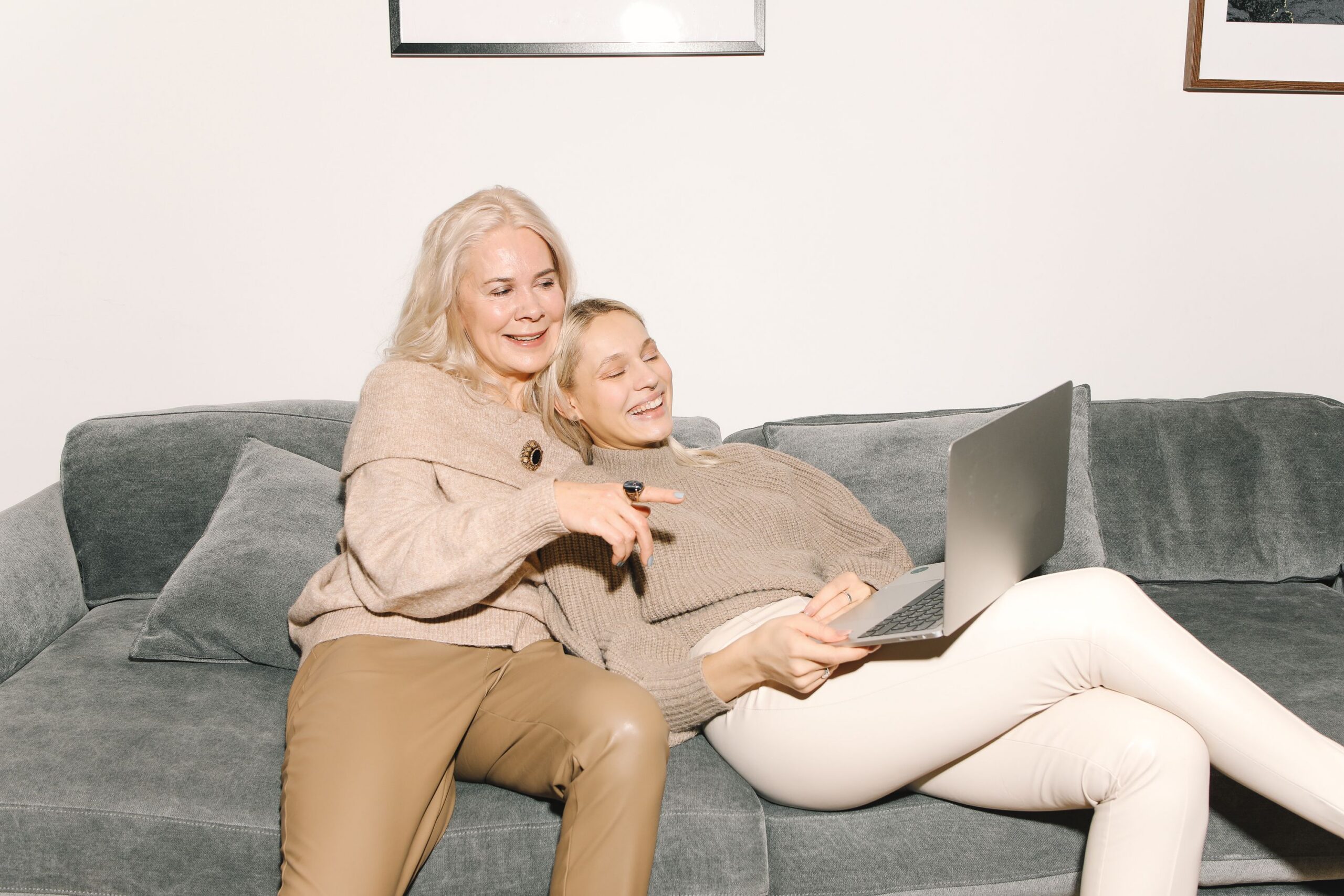 Adult daughter taking over as successor trustee while reviewing living trust documents with her aging mother